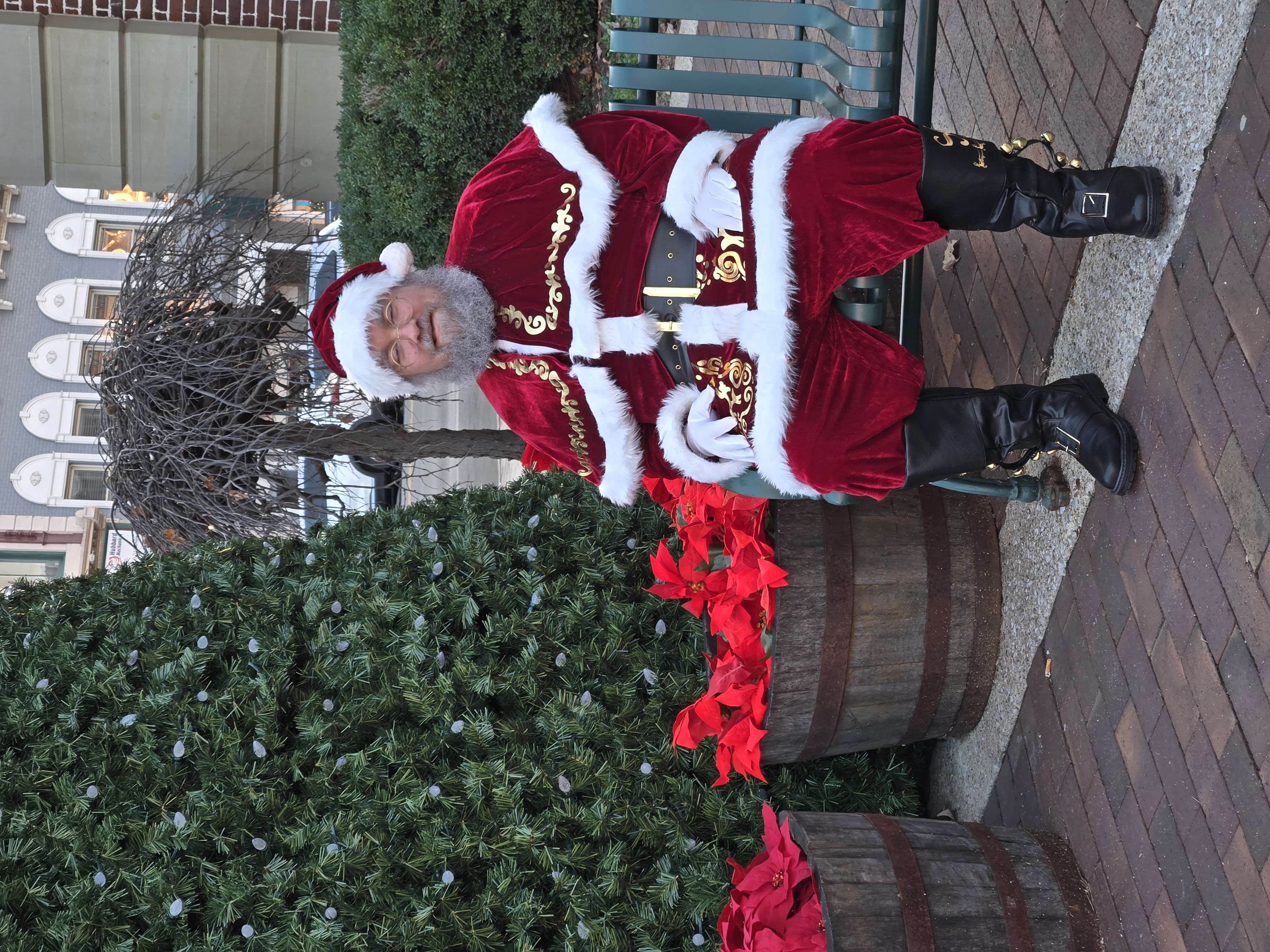 Saint Nick in front of a Christmas tree
